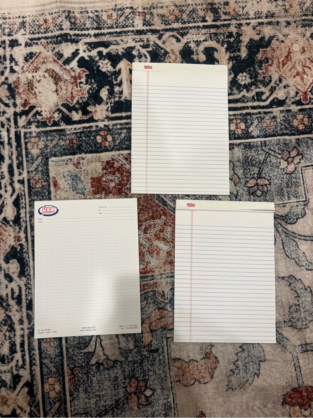 three notepads / writing pads (paper),